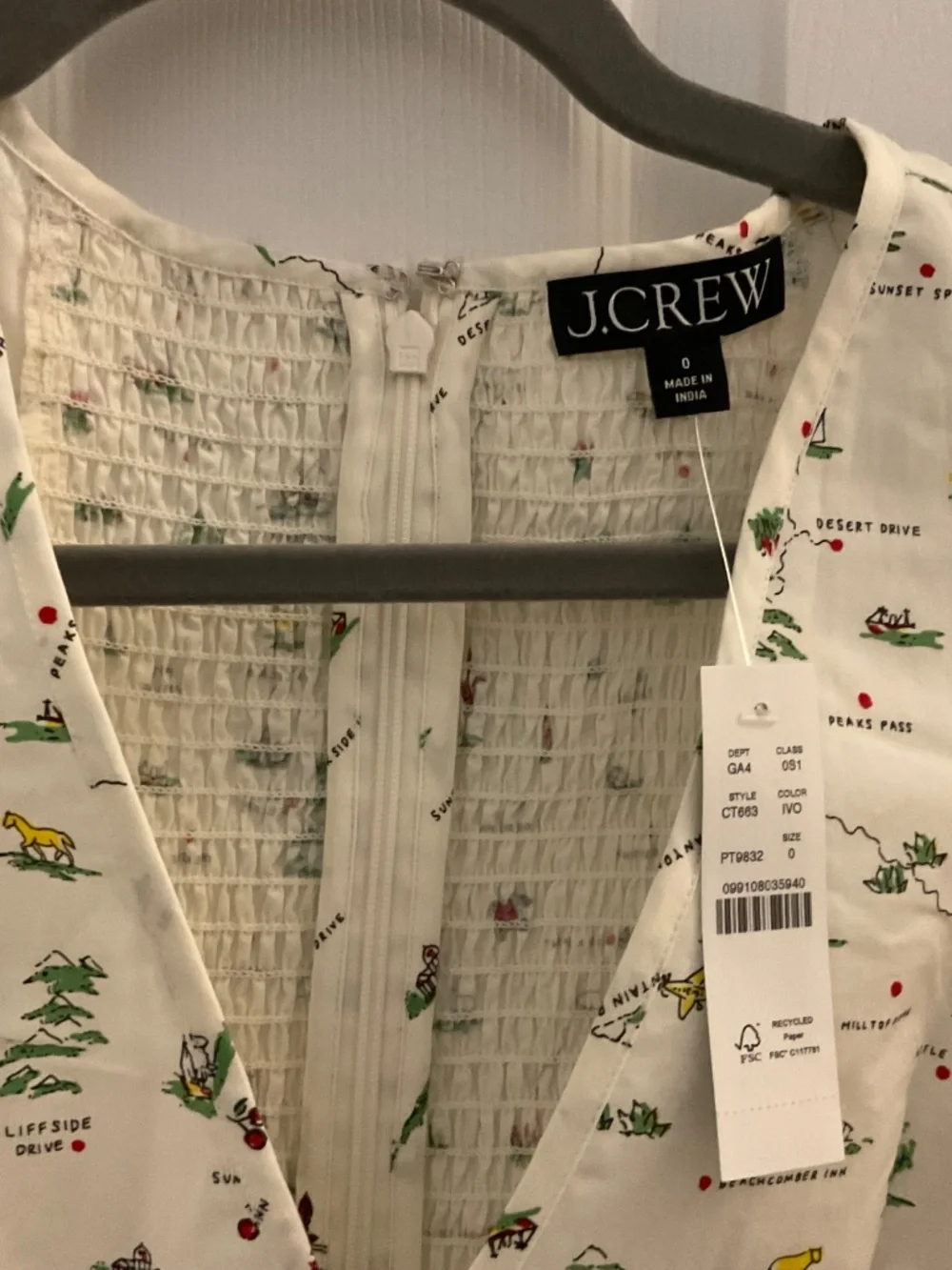 V-neck dress. In map print